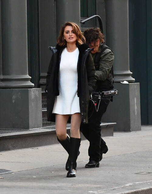 20 April 2024 - EXCLUSIVE.Penelope Cruz strikes a pose during a photoshoot in the SoHo neighborhood on New York City. The 49 year old Spanish actress modeled a black jacket, white dress, and black boots for the Geox fashion label.Credit: GoffPhotos.com   Ref: KGC-339/TIDNY-195**UK Sales Only - No Daily Mail Group/No Sun Group - Exclusive - Newspapers Allrounder - Magazines Double Space Rates - Web/Online Must Call Before Use**