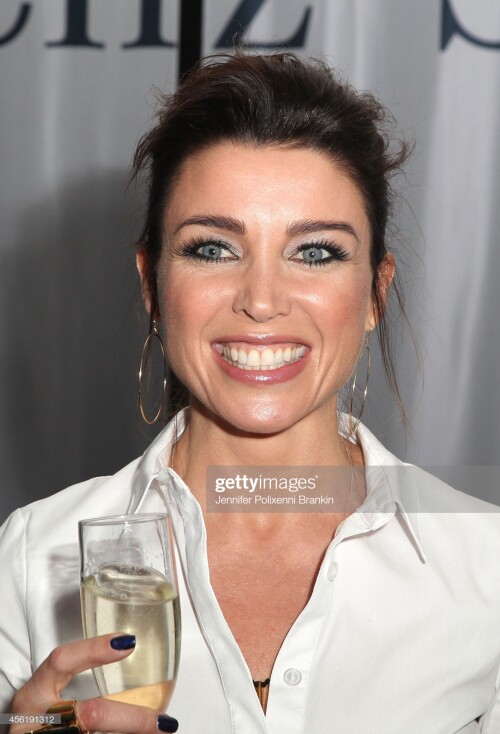 SYDNEY, AUSTRALIA - SEPTEMBER 27:  Dannii Minogue celebrates after the Target Runway show during Mercedes-Benz Fashion Festival Sydney at Sydney Town Hall on September 27, 2014 in Sydney, Australia.  (Photo by Jennifer Polixenni Brankin/WireImage)